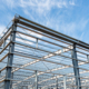 Side view of steel structure workshop with blue sky